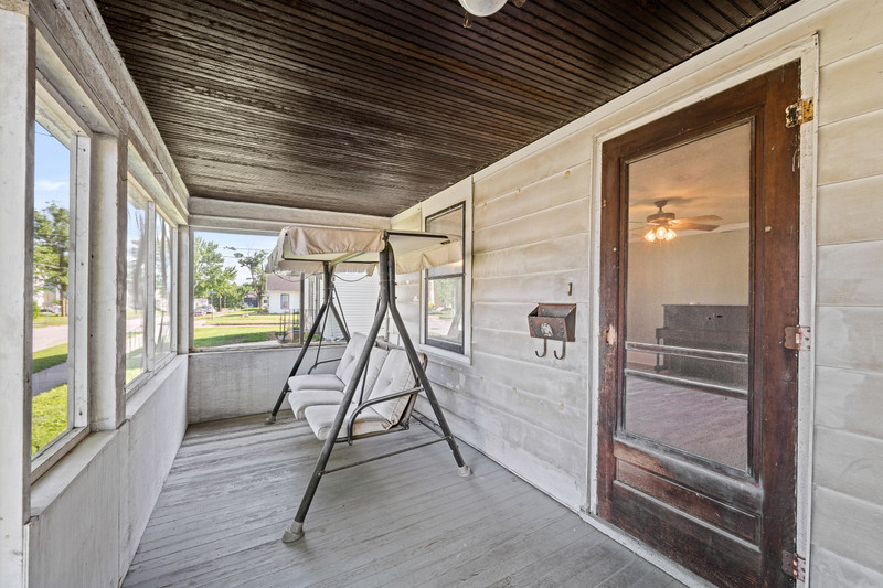 1419 17th Street Moline, IL 61265 - Photo 6 of 28 a bathroom with a glass shower door and a glass door
