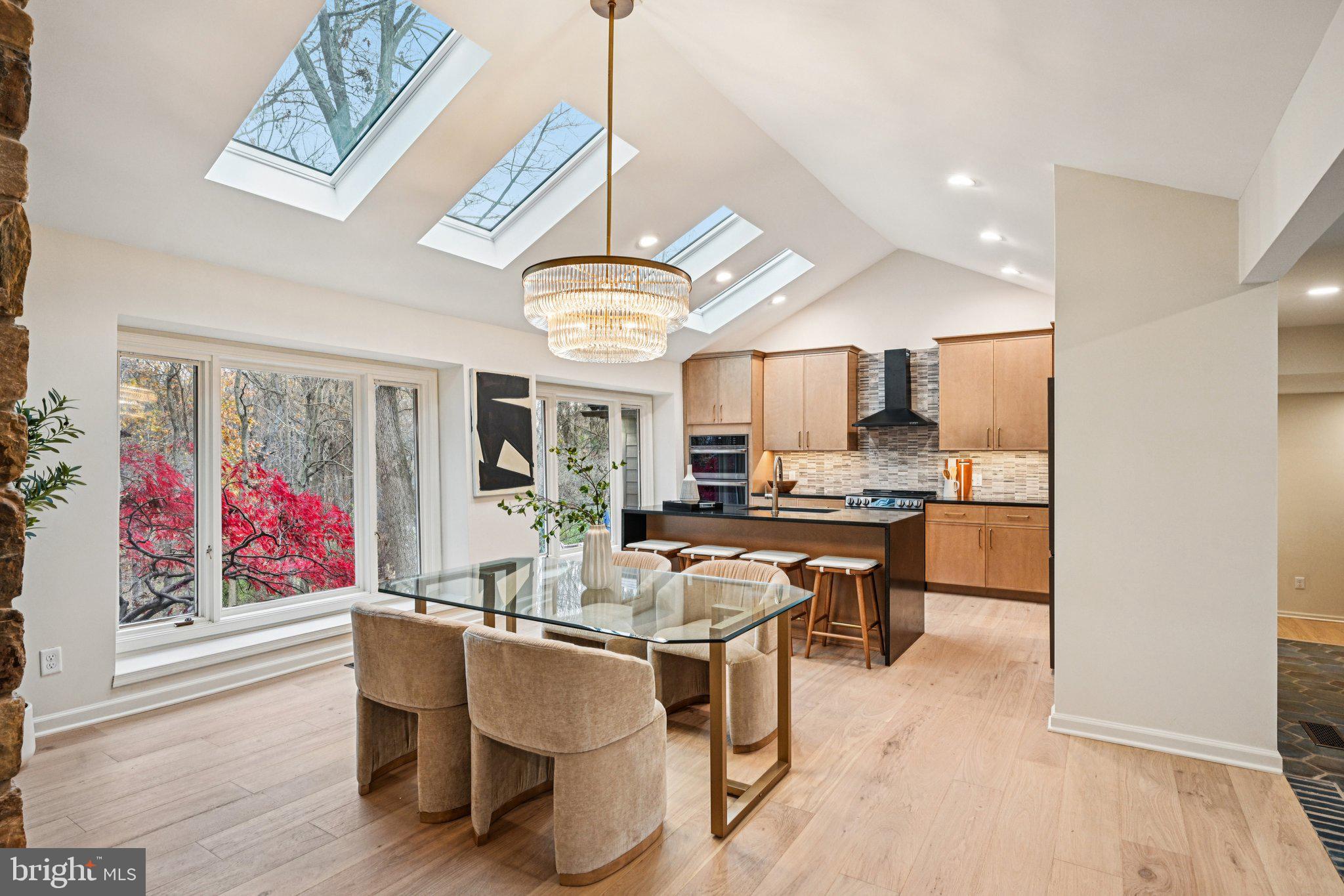 38 Ringfield Road Chadds Ford, PA 19317 - Photo 11 of 50 a dining room with wooden floor a chandelier a wooden table and chairs