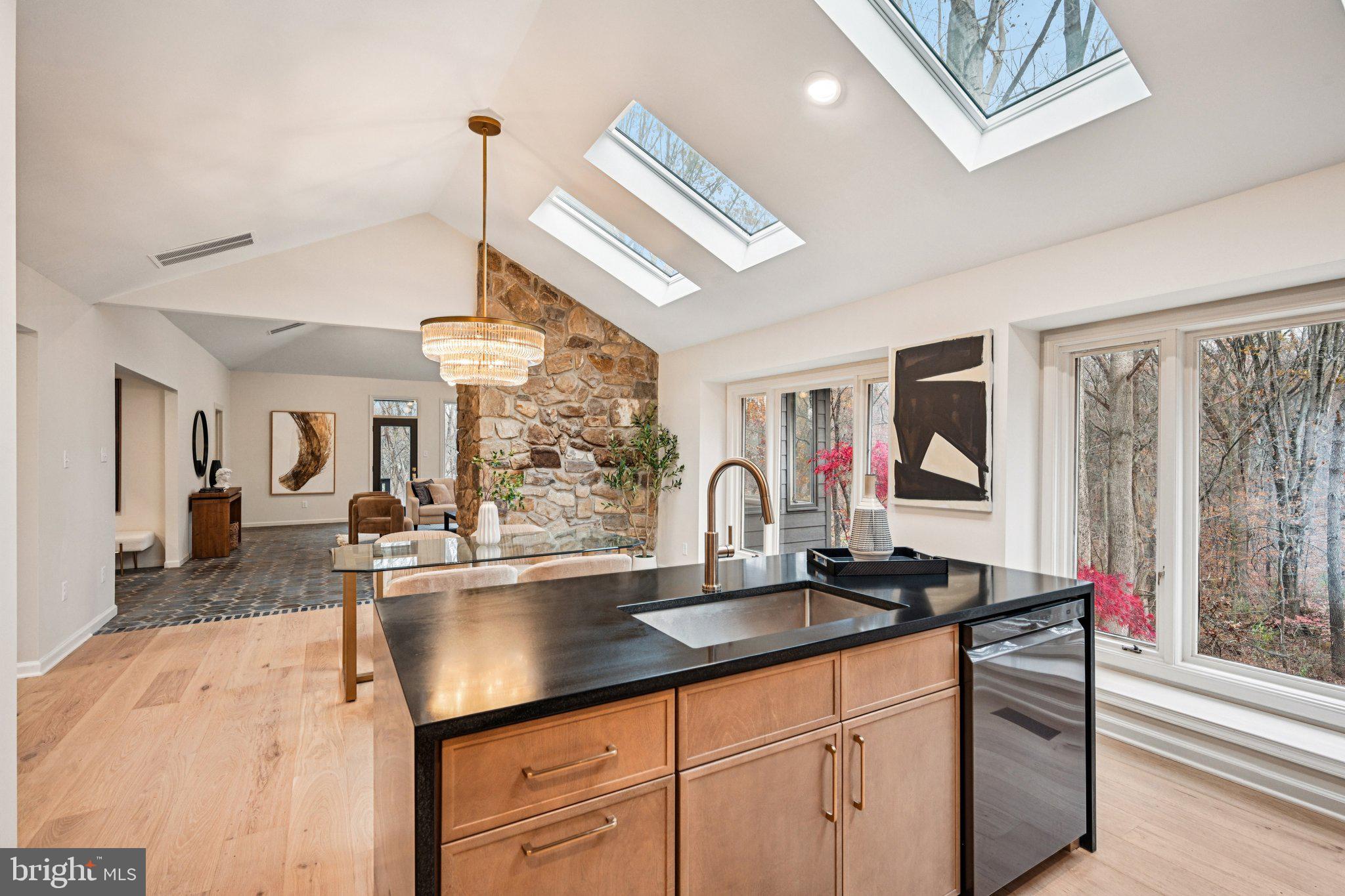 38 Ringfield Road Chadds Ford, PA 19317 - Photo 14 of 50 a dining hall with granite countertop a sink dishwasher a dining table and chairs with wooden floor