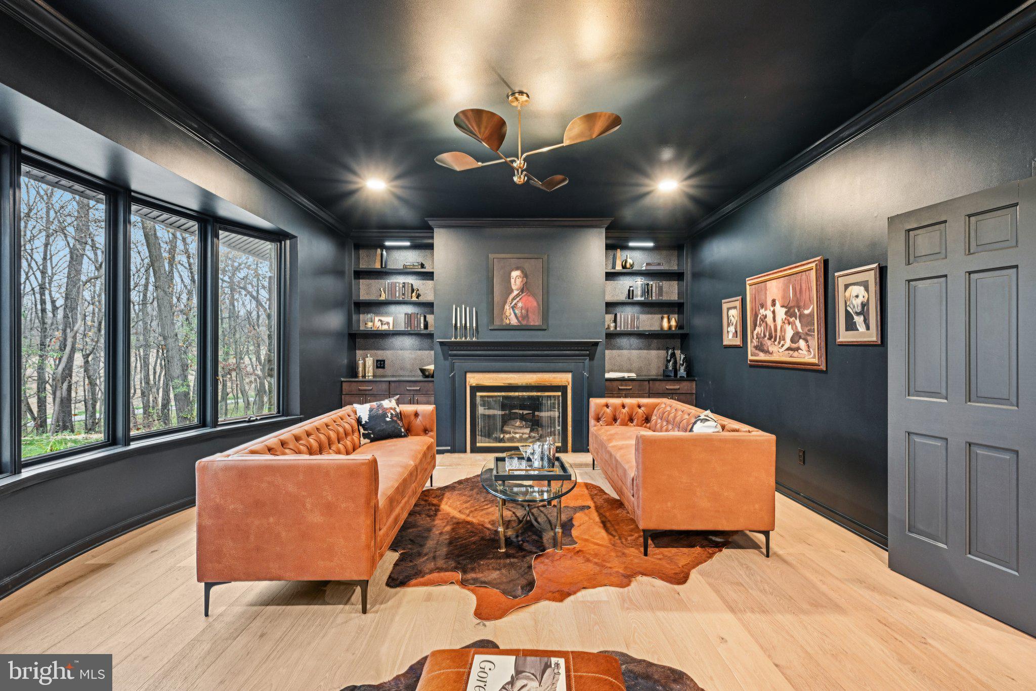 38 Ringfield Road Chadds Ford, PA 19317 - Photo 20 of 50 a living room with fireplace furniture and a large window