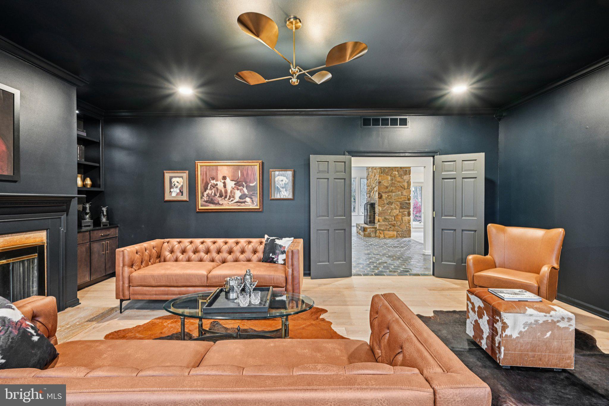 38 Ringfield Road Chadds Ford, PA 19317 - Photo 21 of 50 a living room with a couch and a flat screen tv