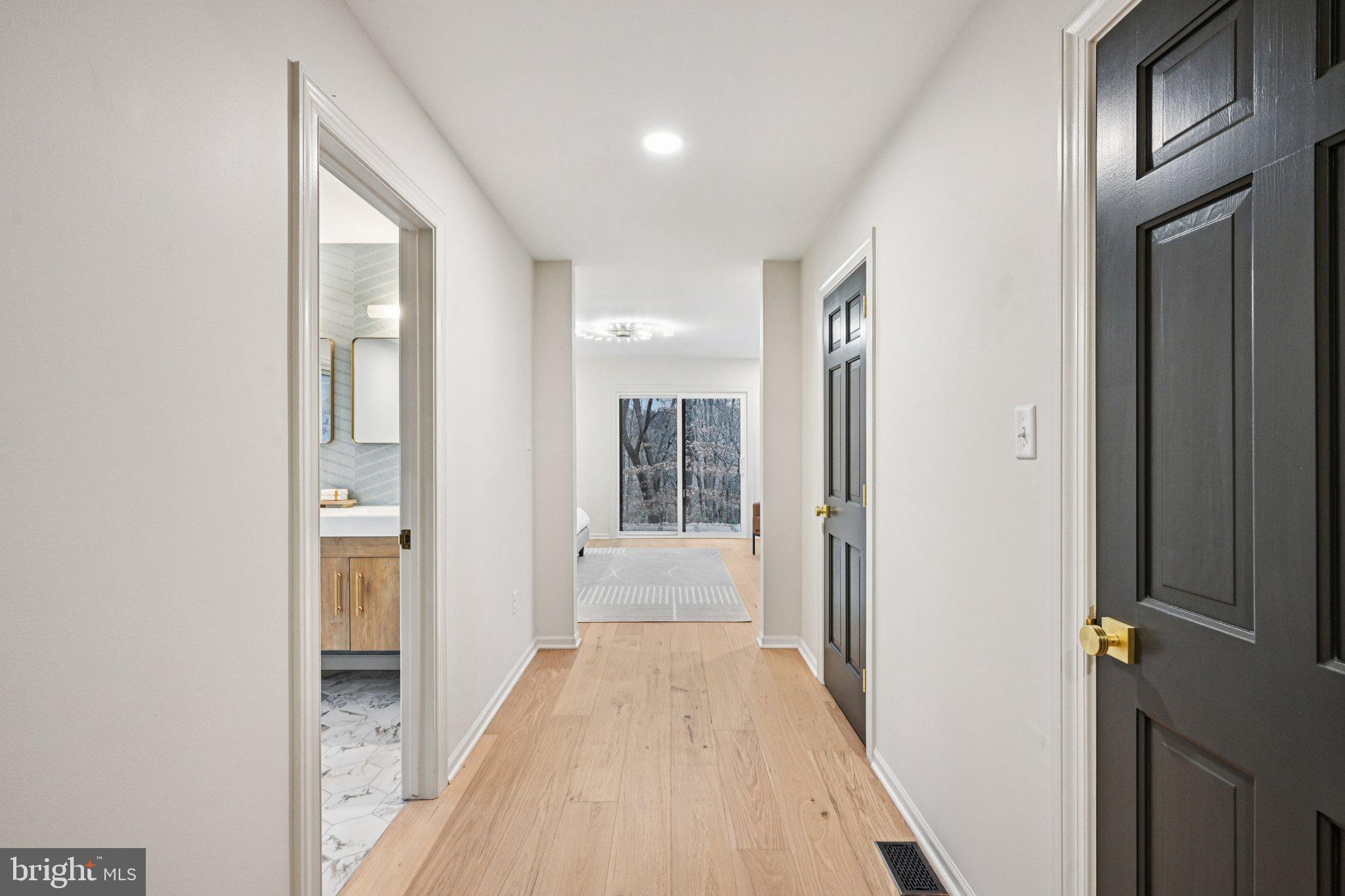 38 Ringfield Road Chadds Ford, PA 19317 - Photo 23 of 50 a view of a hallway with wooden floor and staircase