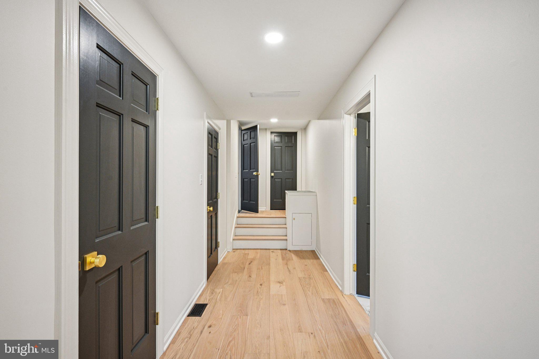 38 Ringfield Road Chadds Ford, PA 19317 - Photo 24 of 50 a view of a hallway with wooden floor and staircase