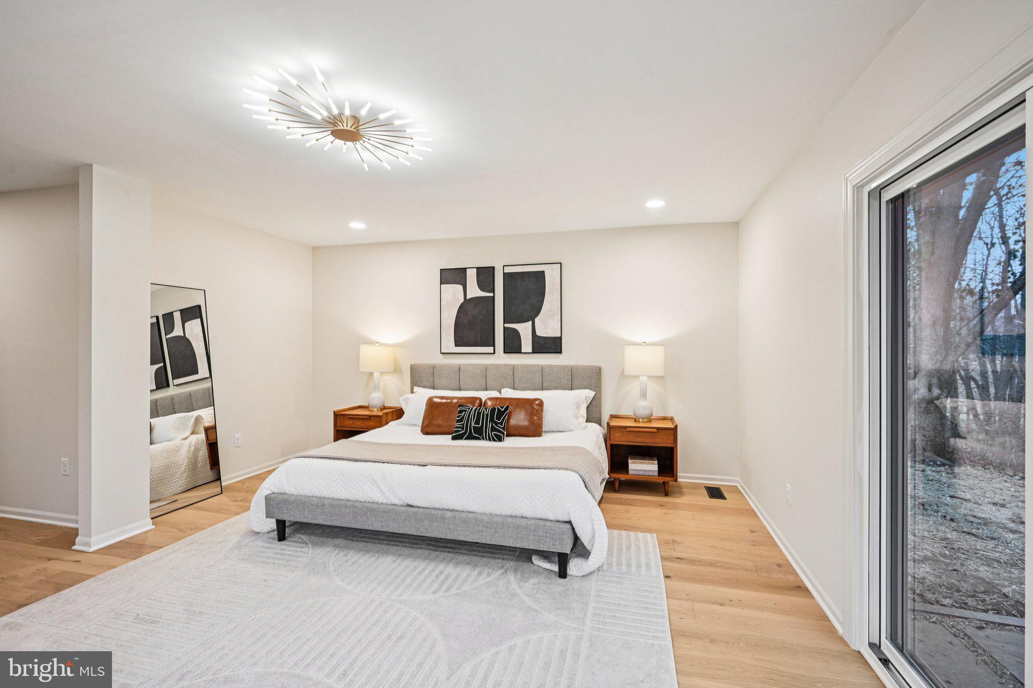 38 Ringfield Road Chadds Ford, PA 19317 - Photo 25 of 50 a bedroom with a bed and a chandelier