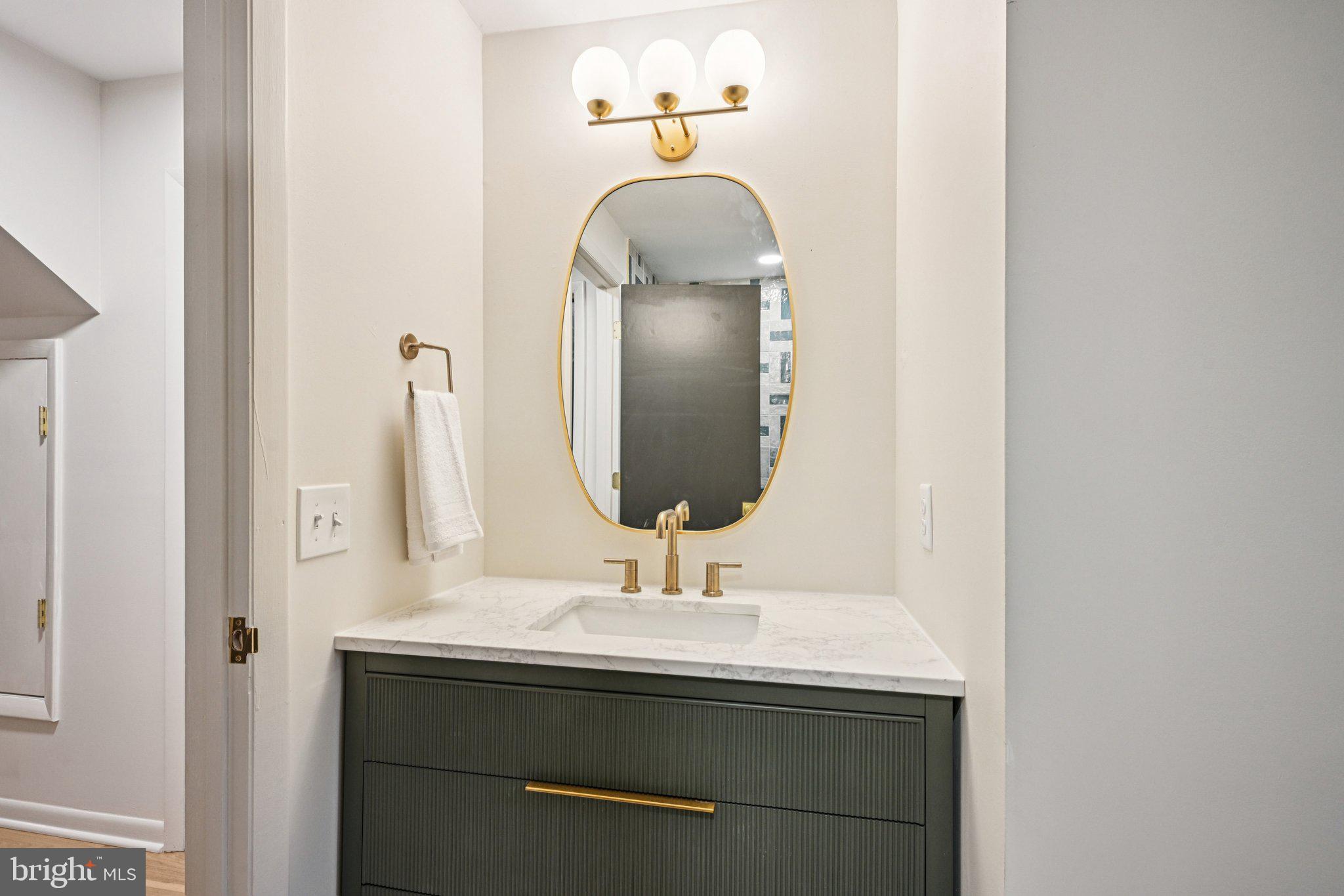 38 Ringfield Road Chadds Ford, PA 19317 - Photo 38 of 50 a bathroom with a sink and a mirror