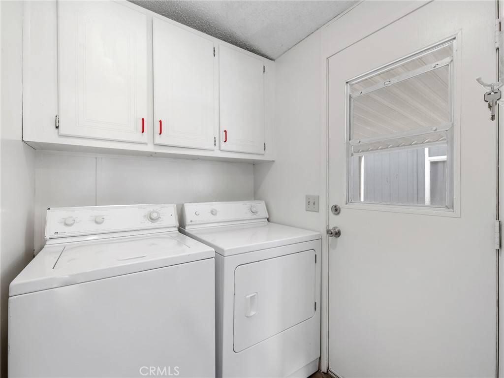 22020 Nisqually Road, Unit 3 Apple Valley, CA 92308 - Photo 14 of 35 a view of storage and utility room with washer and dryer