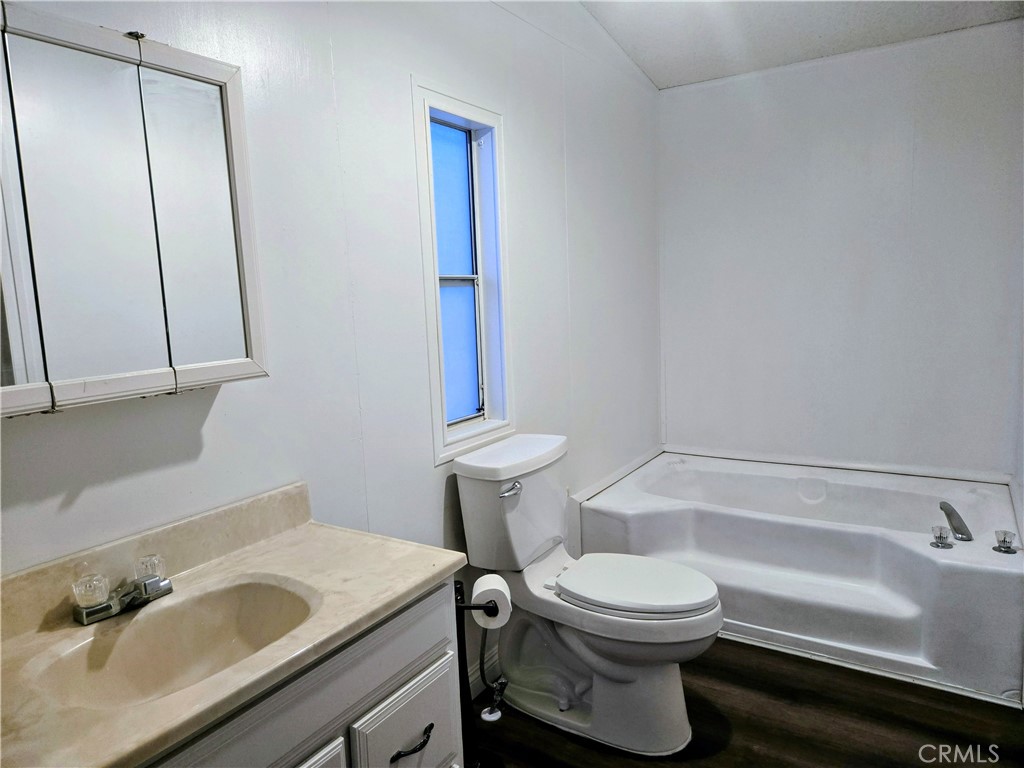 22020 Nisqually Road, Unit 3 Apple Valley, CA 92308 - Photo 24 of 35 a bathroom with a sink and a toilet
