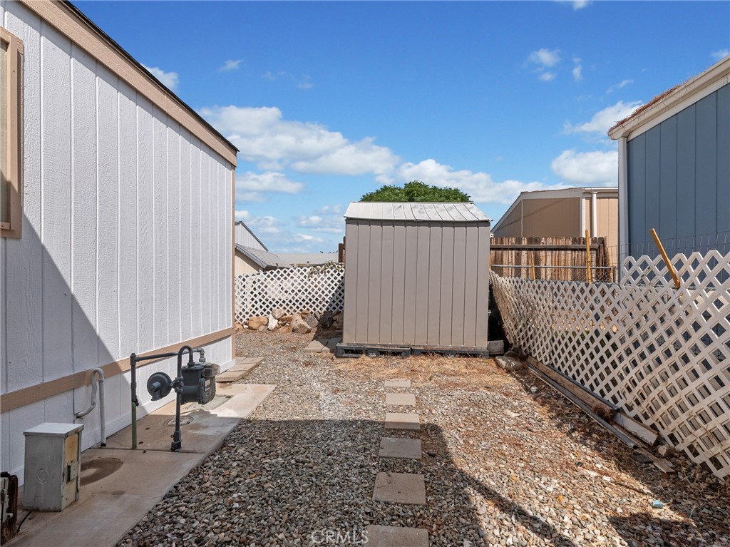 22020 Nisqually Road, Unit 3 Apple Valley, CA 92308 - Photo 29 of 35 a view of a house with a wooden fence