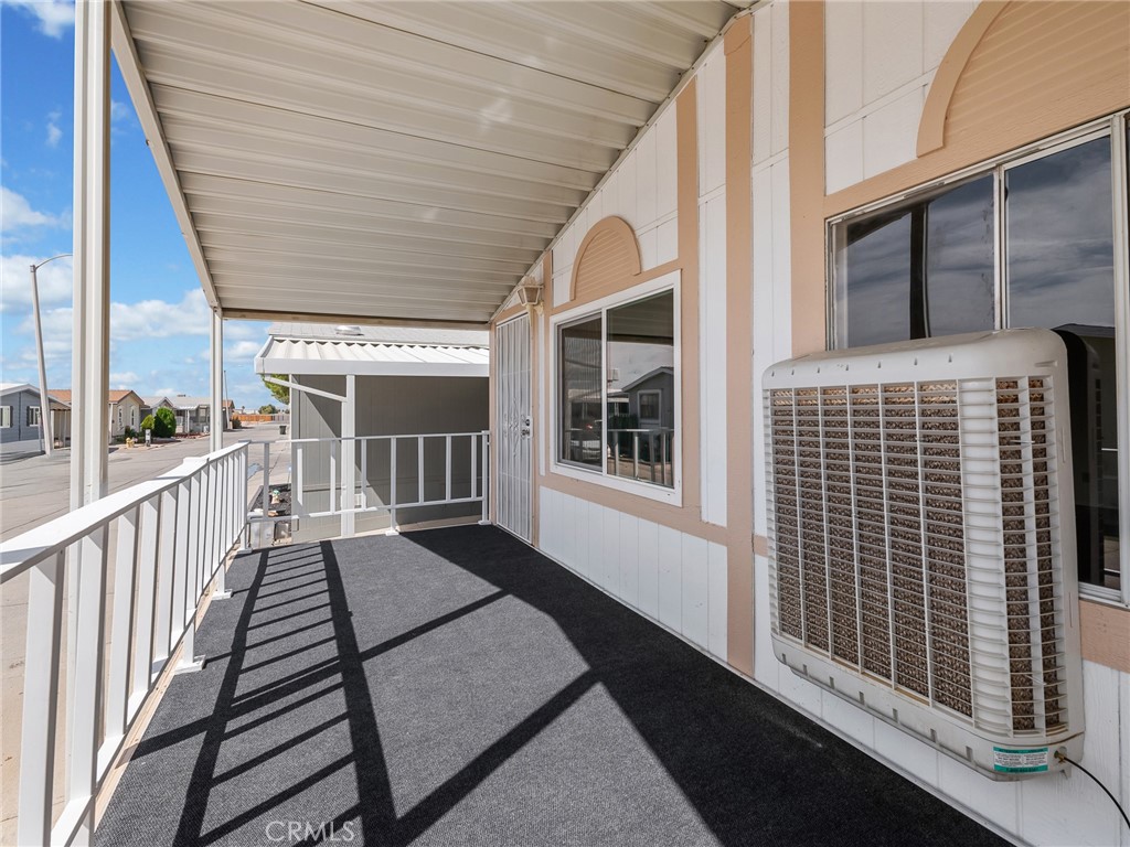 22020 Nisqually Road, Unit 3 Apple Valley, CA 92308 - Photo 6 of 35 a view of a balcony with wooden floor