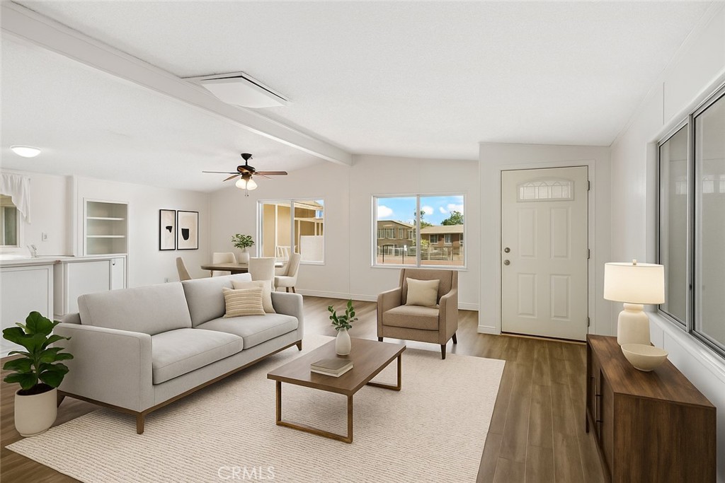22020 Nisqually Road, Unit 3 Apple Valley, CA 92308 - Photo 7 of 35 a living room with furniture and a wooden floor
