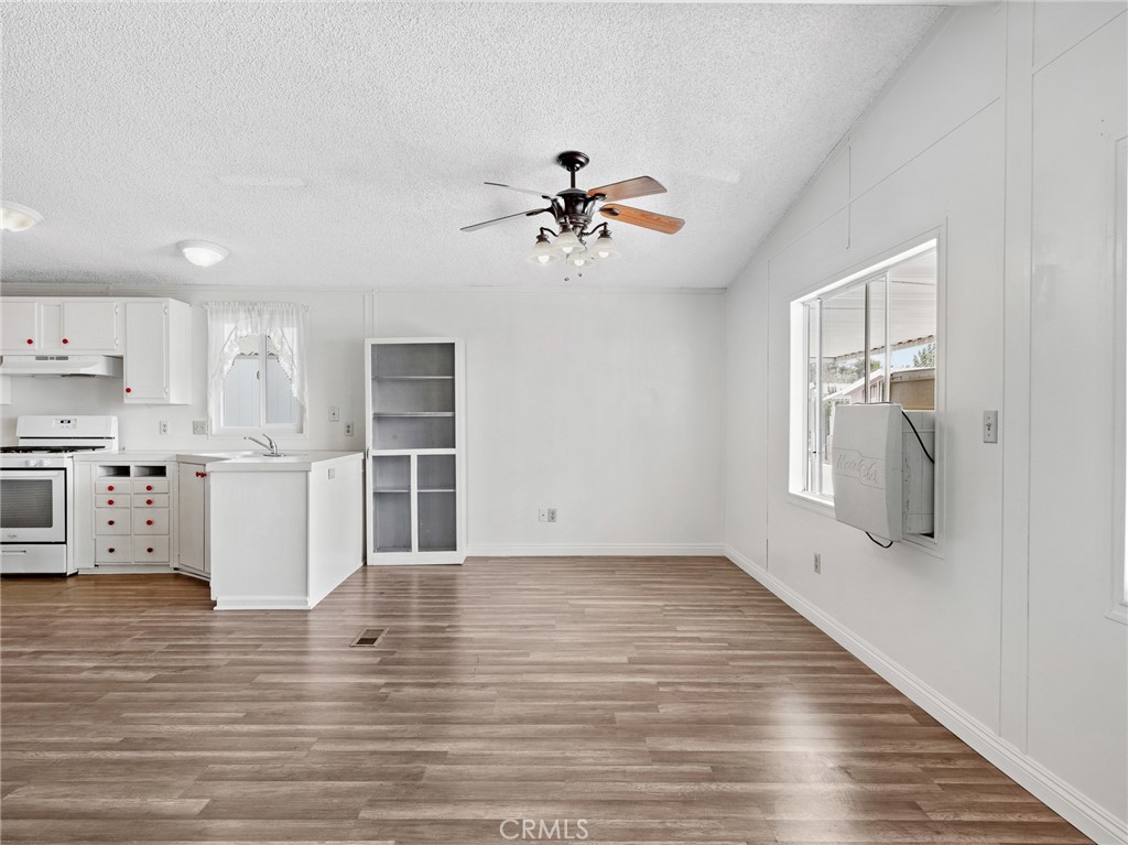 22020 Nisqually Road, Unit 3 Apple Valley, CA 92308 - Photo 10 of 35 a view of cabinets and wooden floor