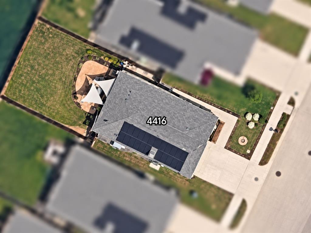 4416 Culrin Way Forney, TX 75126 - Photo 18 of 18 Asphalt shingle roof with solar panels