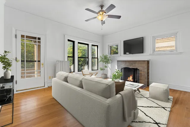 a living room with furniture fireplace and a flat screen tv