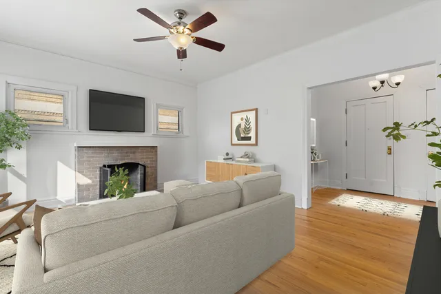 a living room with furniture and a fireplace