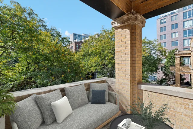 a balcony view with couple of chairs