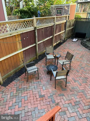 a view of a chairs and bench in the deck