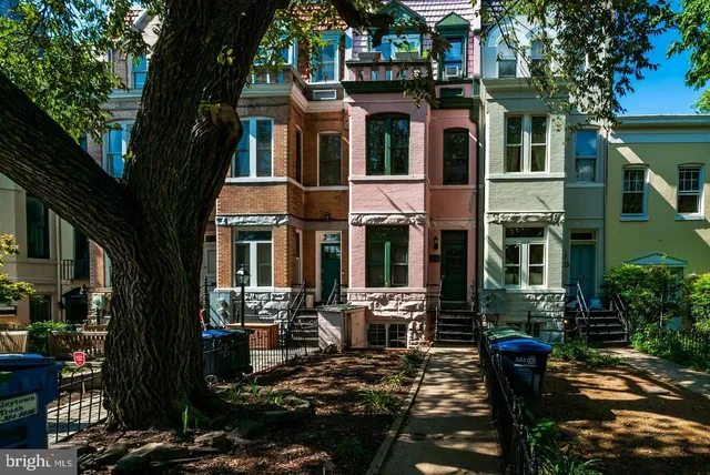a front view of a building with many windows