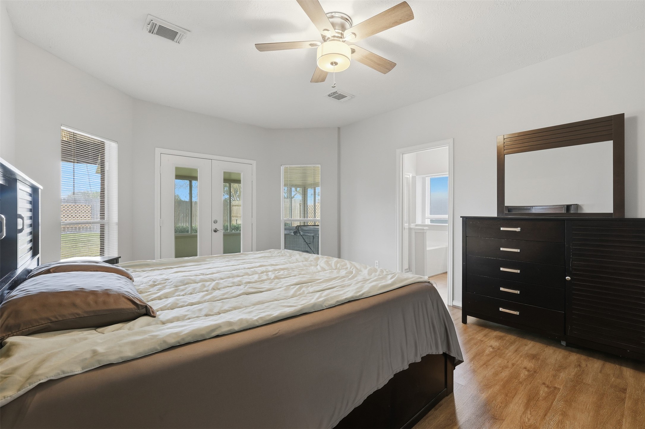 2202 Melanie Park Drive Spring, TX 77388 - Photo 14 of 26 a bedroom with a bed and a dresser