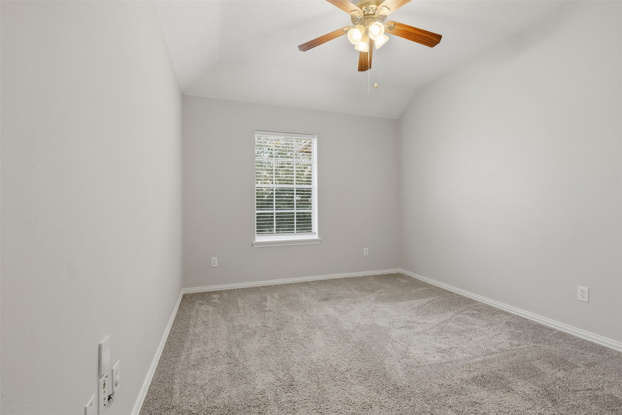 2202 Melanie Park Drive Spring, TX 77388 - Photo 22 of 26 an empty room with windows and fan