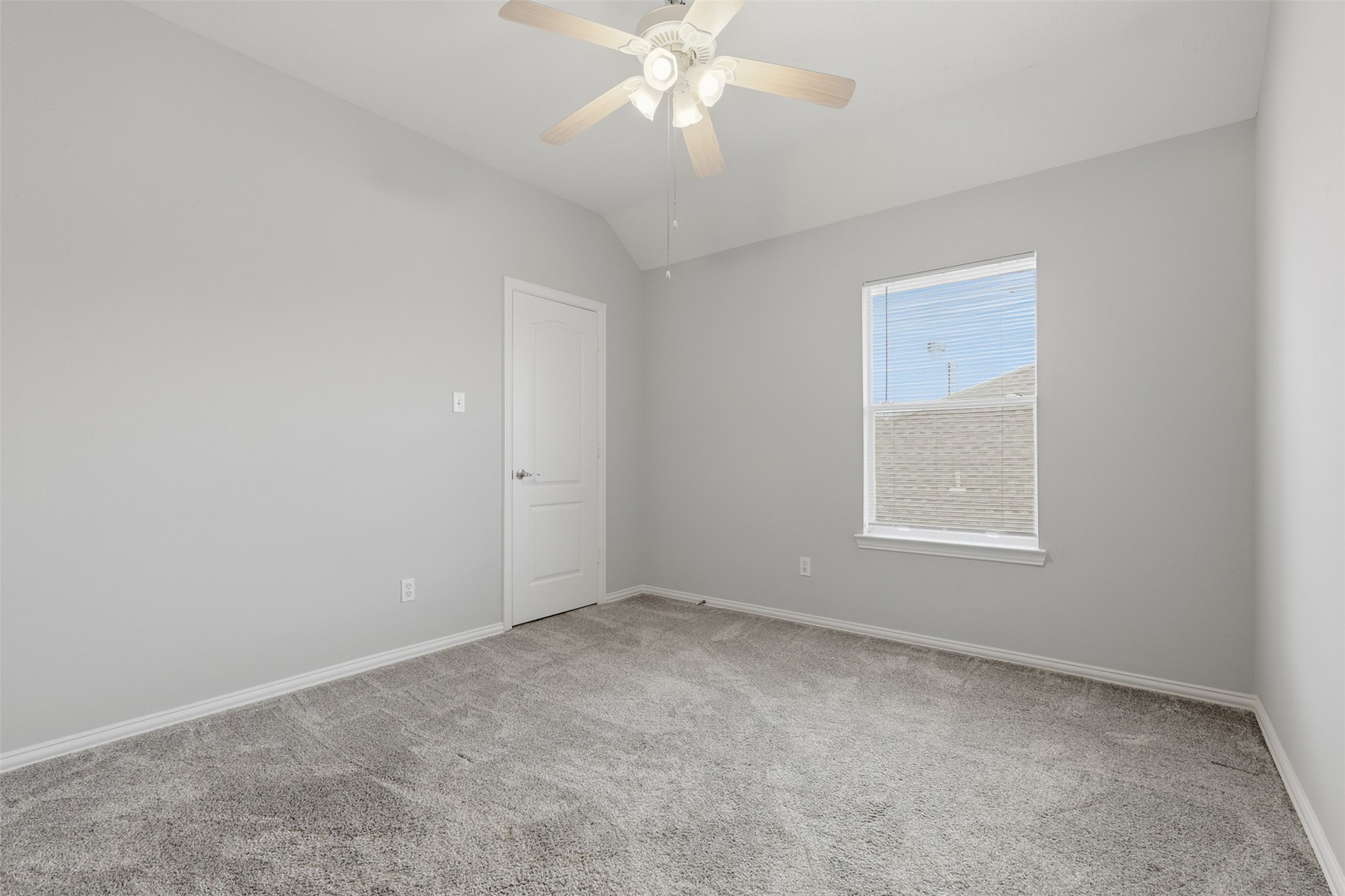 2202 Melanie Park Drive Spring, TX 77388 - Photo 24 of 26 an empty room with a window and a fan