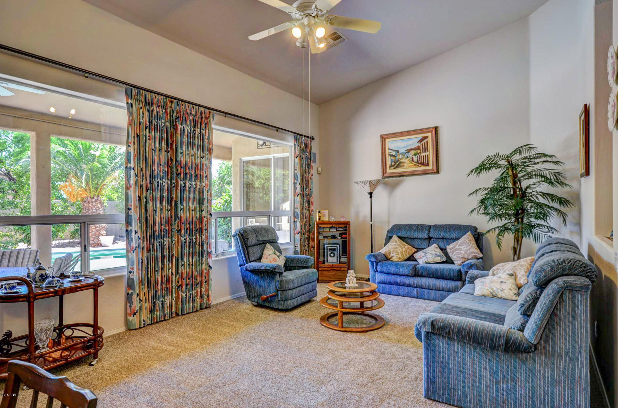 5311 East Danbury Road Scottsdale, AZ 85254 - Photo 14 of 39 a living room with furniture and a large window