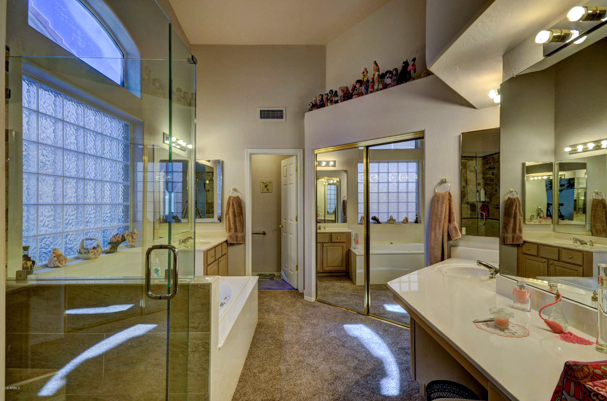 5311 East Danbury Road Scottsdale, AZ 85254 - Photo 22 of 39 a bathroom with a sink and a mirror