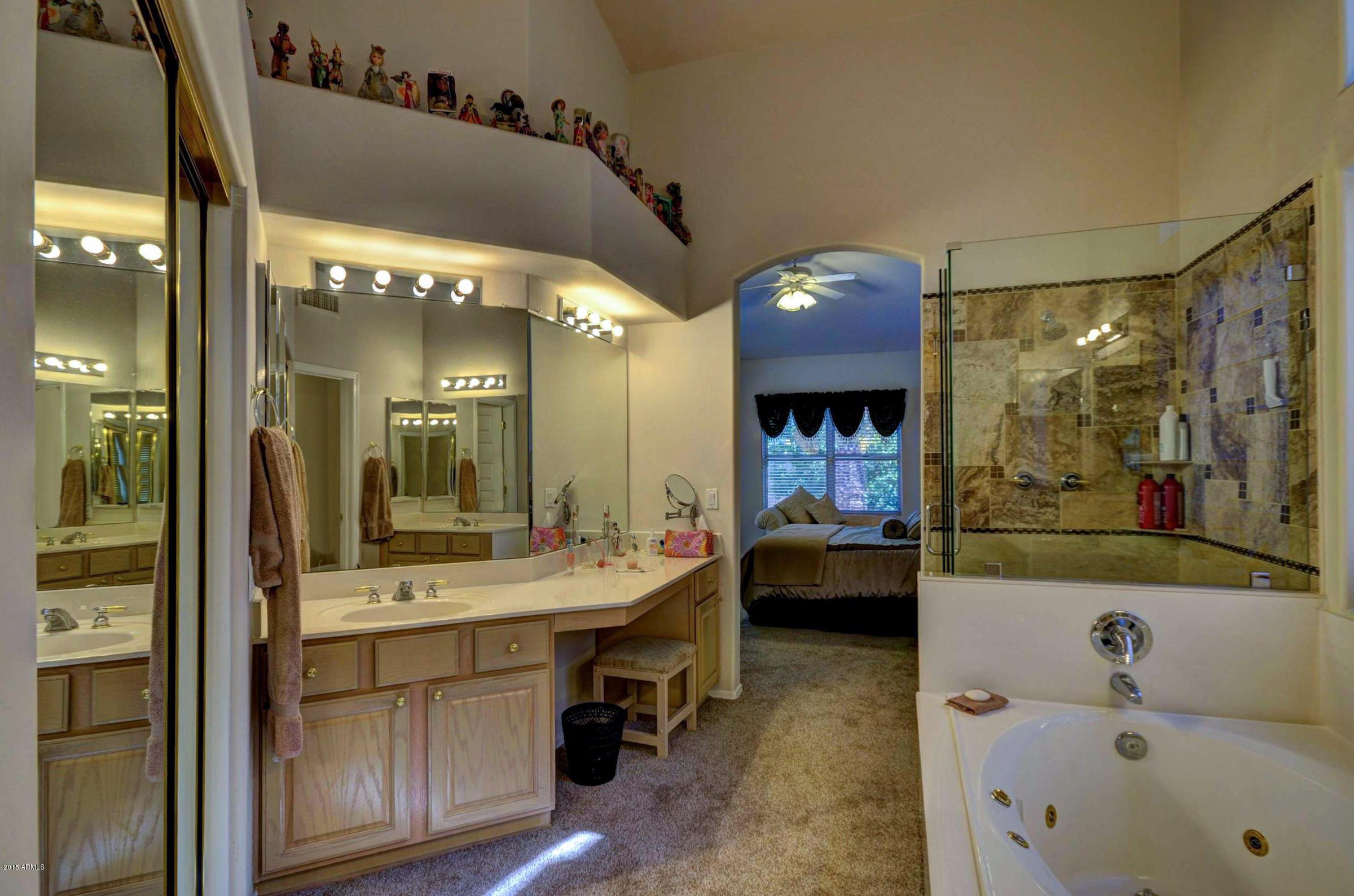 5311 East Danbury Road Scottsdale, AZ 85254 - Photo 23 of 39 a bathroom with a double vanity sink mirror and bathtub