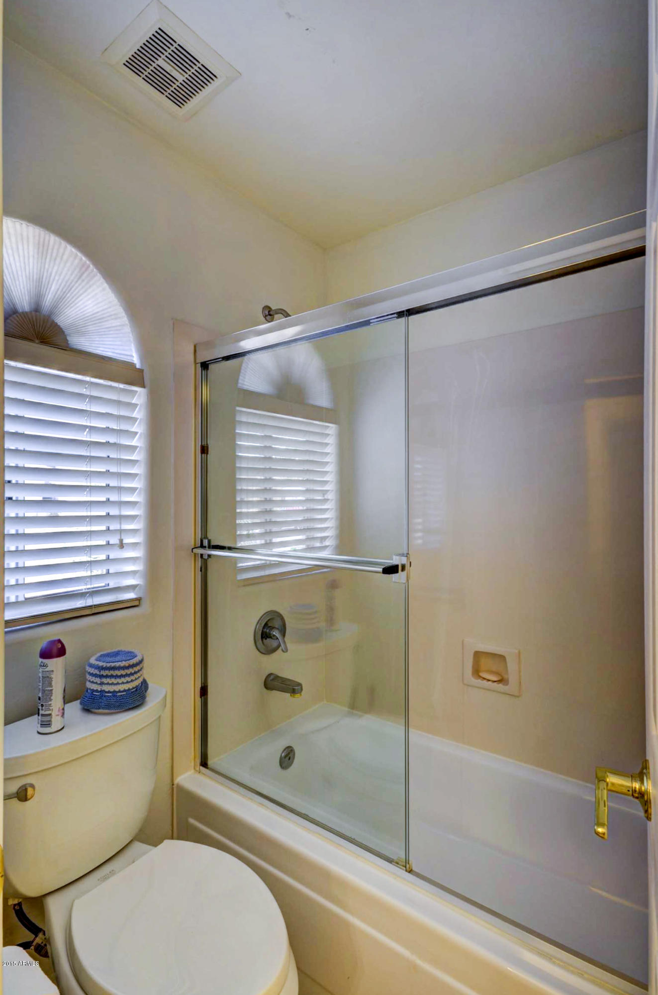 5311 East Danbury Road Scottsdale, AZ 85254 - Photo 30 of 39 a bathroom with a granite countertop toilet a sink and shower