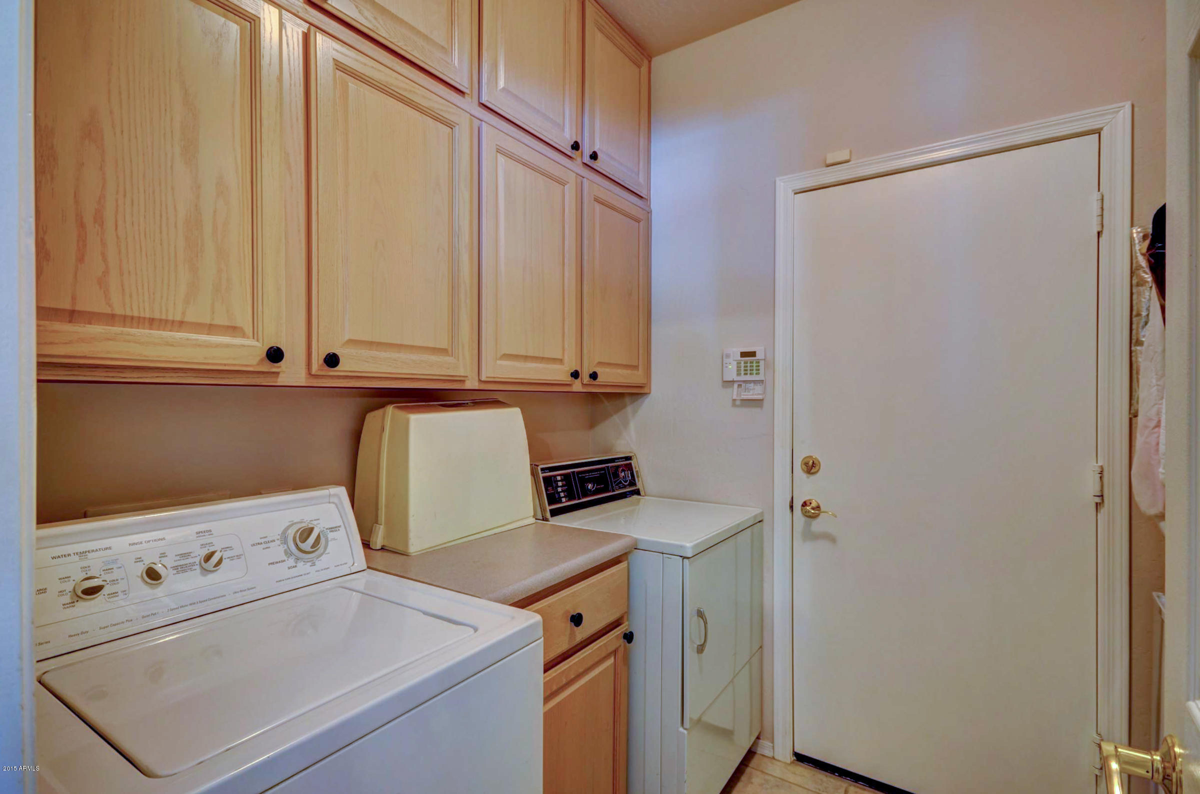 5311 East Danbury Road Scottsdale, AZ 85254 - Photo 34 of 39 a view of storage and utility room with washer and dryer