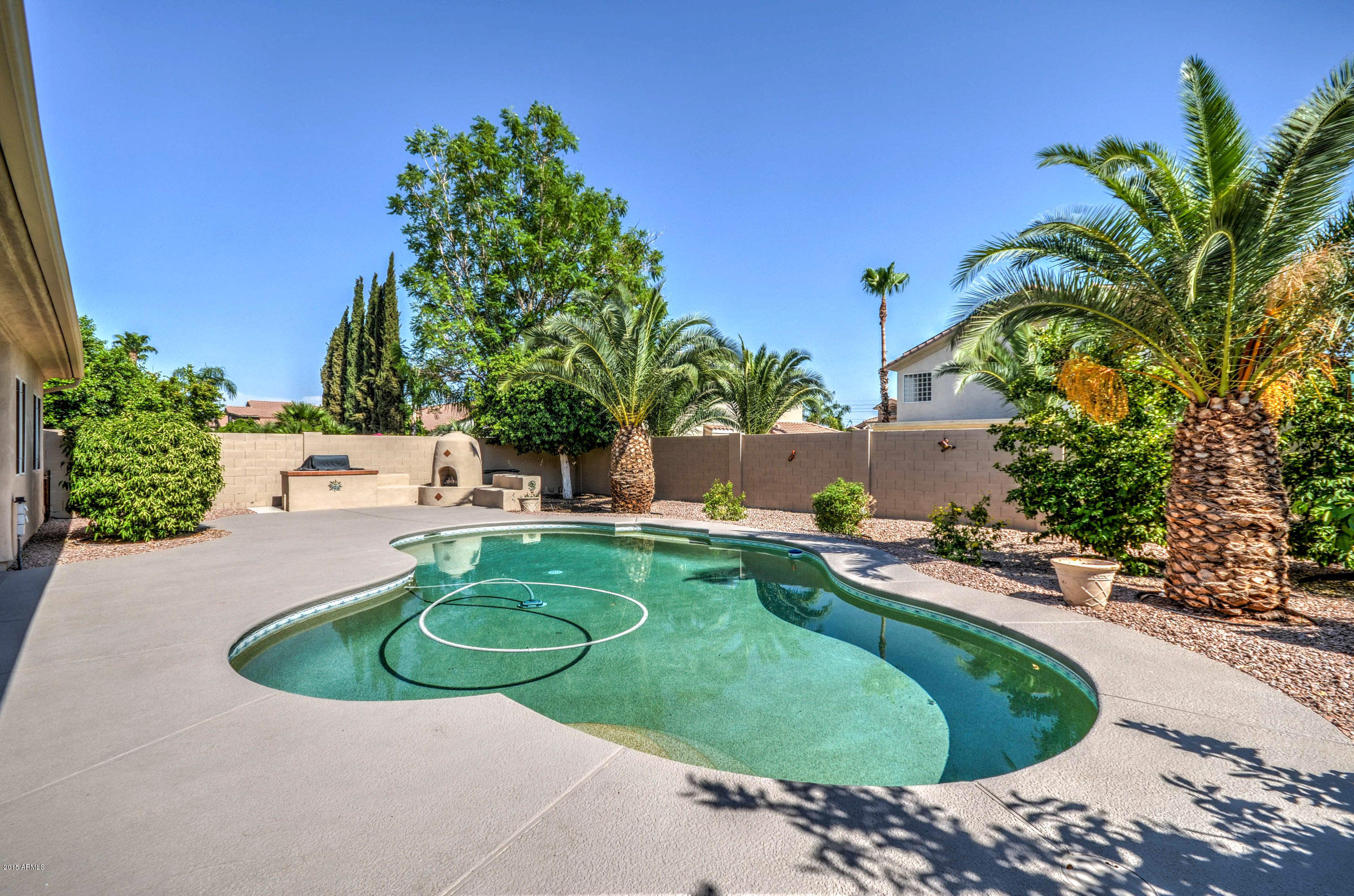 5311 East Danbury Road Scottsdale, AZ 85254 - Photo 37 of 39 a view of a swimming pool with a yard