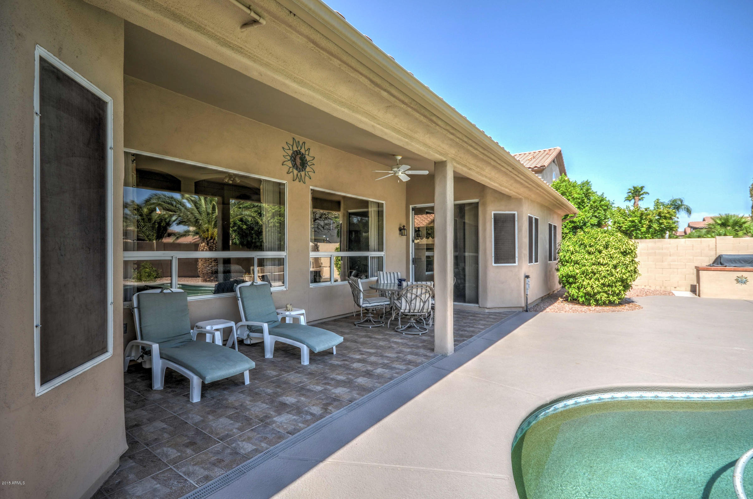 5311 East Danbury Road Scottsdale, AZ 85254 - Photo 38 of 39 a view of a patio with table and chairs and potted plants
