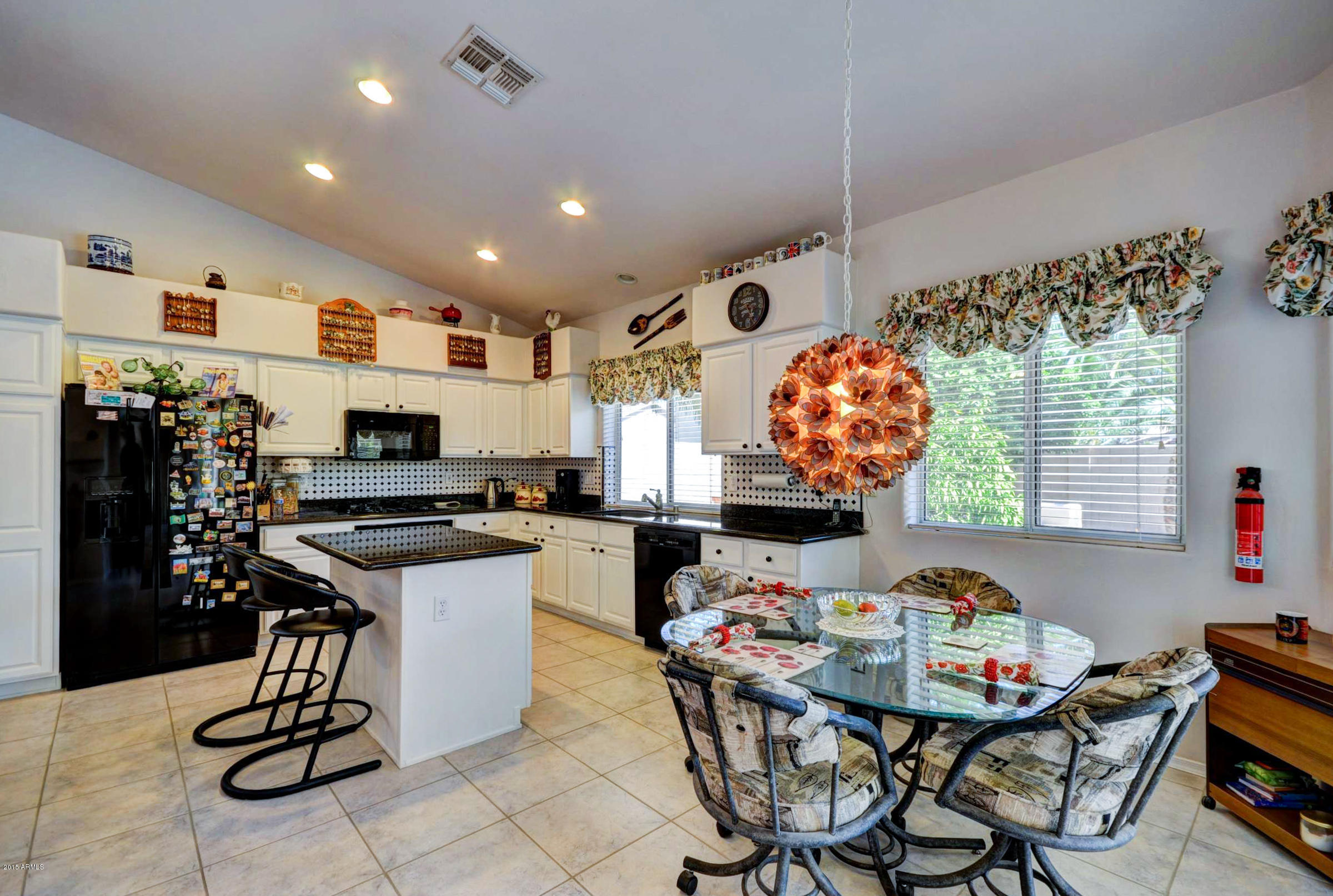 5311 East Danbury Road Scottsdale, AZ 85254 - Photo 6 of 39 a view of a dining room with furniture and chandelier