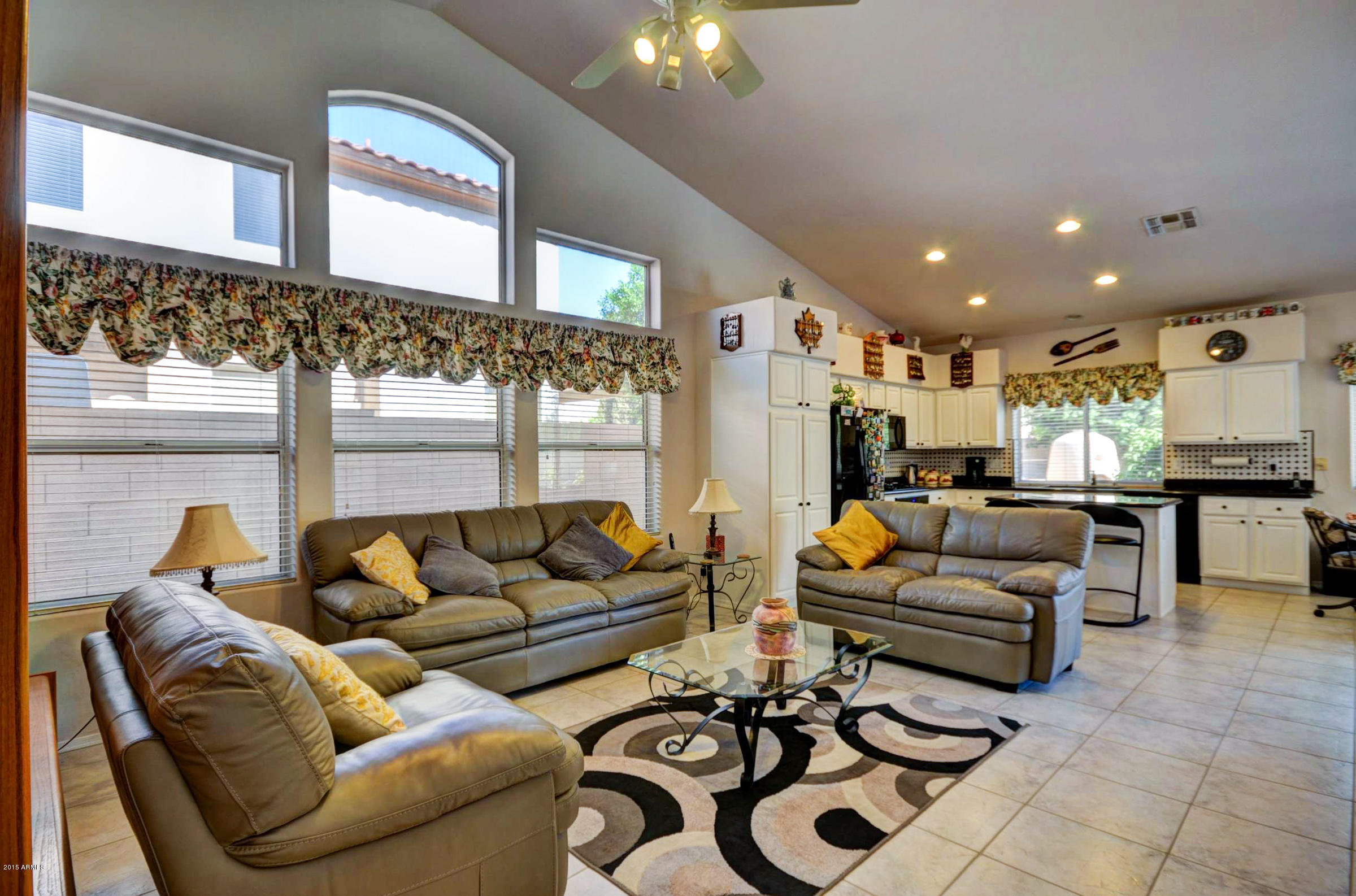 5311 East Danbury Road Scottsdale, AZ 85254 - Photo 10 of 39 a living room with furniture and a large window