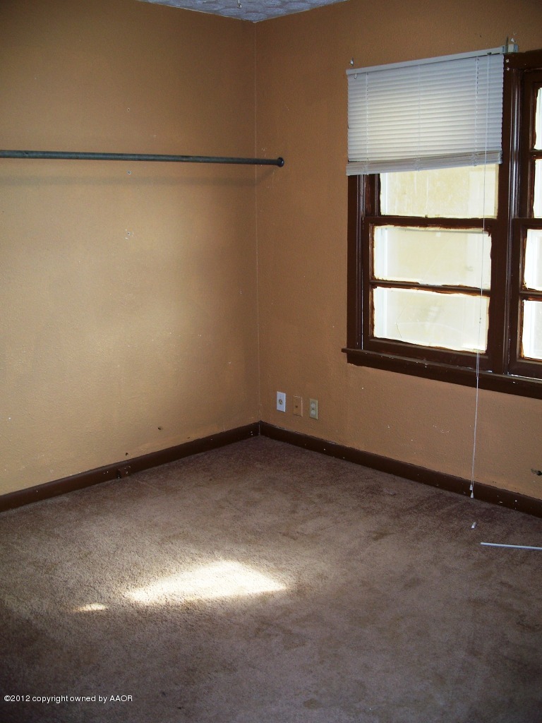 1115 West McCormick Road Amarillo, TX 79118 - Photo 11 of 15 a view of a room that has a window in it