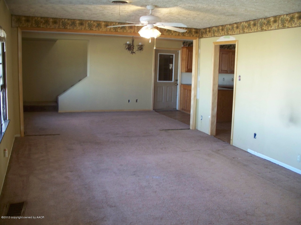 1115 West McCormick Road Amarillo, TX 79118 - Photo 2 of 15 a view of a big room with closet and chandelier fan