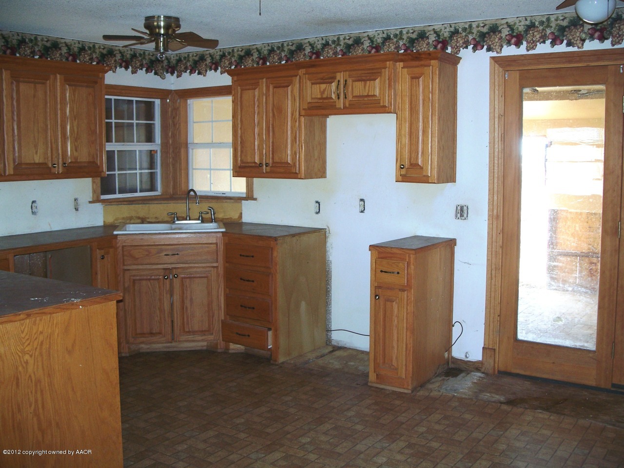 1115 West McCormick Road Amarillo, TX 79118 - Photo 5 of 15 a kitchen with stainless steel appliances a stove a sink a refrigerator and cabinets