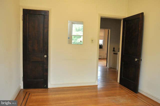 3909 Keswick Road Baltimore, MD 21211 - Photo 13 of 23 a view of a hallway with wooden floor