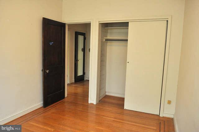 3909 Keswick Road Baltimore, MD 21211 - Photo 16 of 23 a view of a hallway with wooden floor