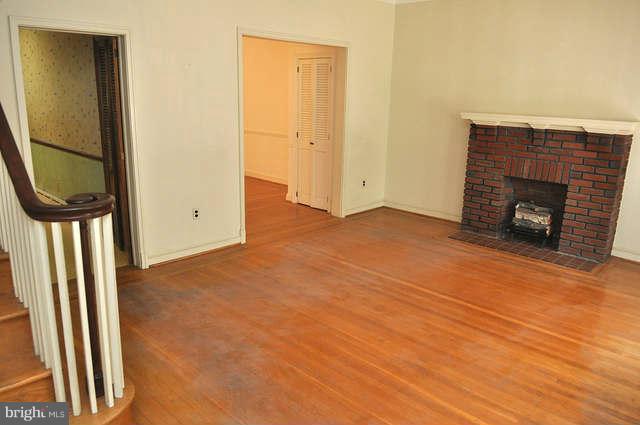 3909 Keswick Road Baltimore, MD 21211 - Photo 5 of 23 an empty room with a fireplace