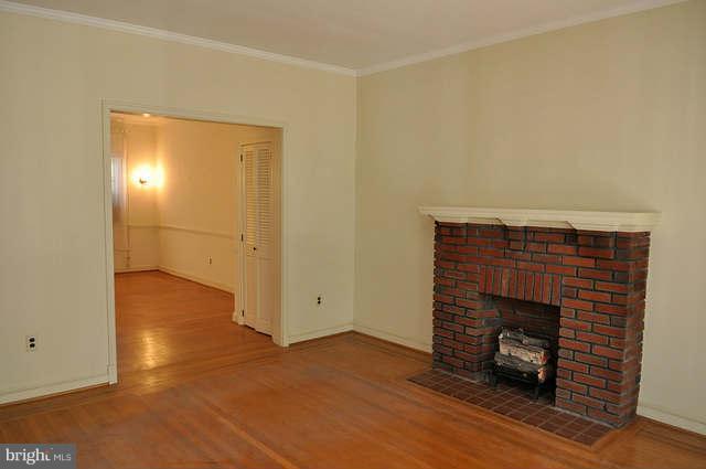 3909 Keswick Road Baltimore, MD 21211 - Photo 6 of 23 a view of empty room with a fireplace