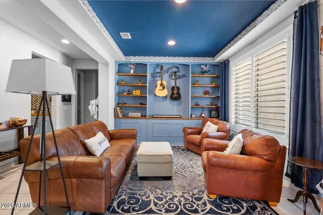 a kitchen with stainless steel appliances granite countertop a refrigerator a sink dishwasher a stove and white cabinets with wooden floor