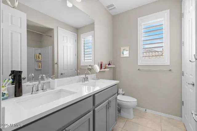 a bedroom with a bed and a desk