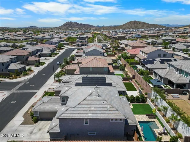 an aerial view of residential houses and street