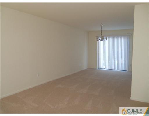 1904 Timber Oaks Road Edison, NJ 08820 - Photo 4 of 6 a view of an empty room and chandelier fan