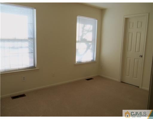 1904 Timber Oaks Road Edison, NJ 08820 - Photo 6 of 6 a view of an empty room with a window