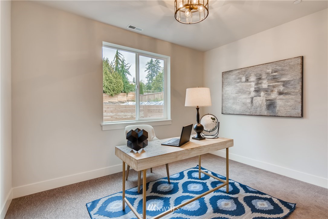 3821 208th Place Southeast Bothell, WA 98021 - Photo 14 of 28 a work room with furniture and a window