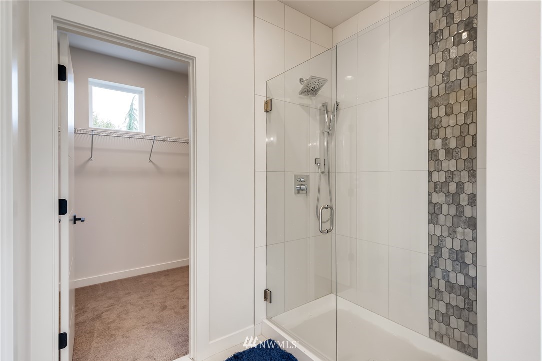 3821 208th Place Southeast Bothell, WA 98021 - Photo 19 of 28 a bathroom with a bathtub and a shower
