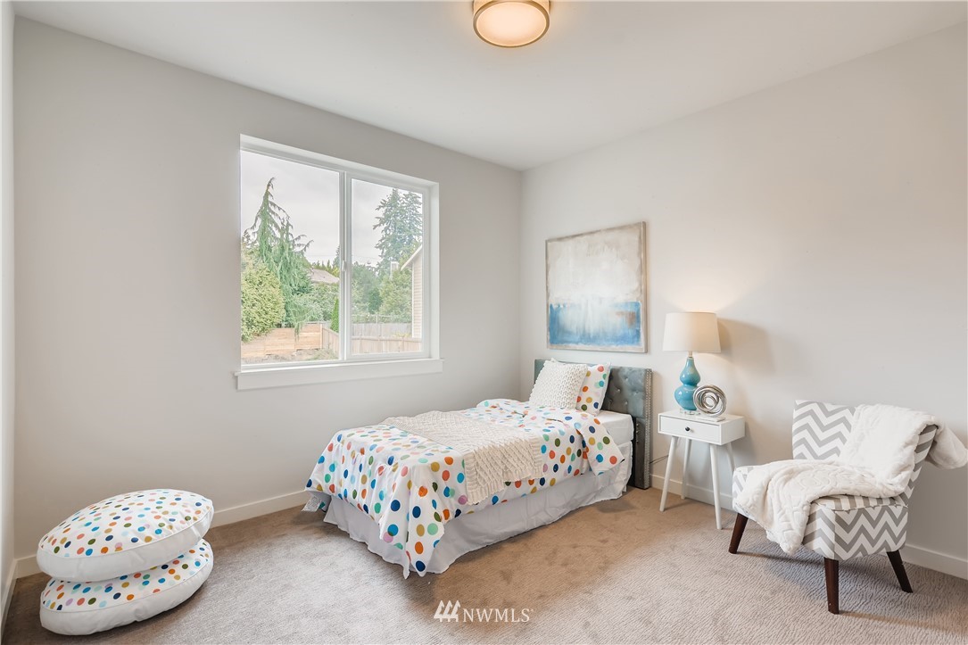 3821 208th Place Southeast Bothell, WA 98021 - Photo 23 of 28 a bedroom with a bed and a window