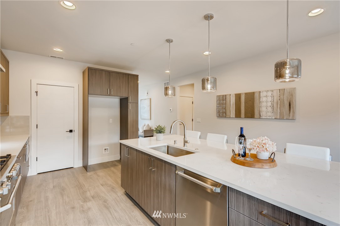 3821 208th Place Southeast Bothell, WA 98021 - Photo 9 of 28 a kitchen with a sink and refrigerator