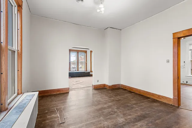 a view of room with window and hardwood floor